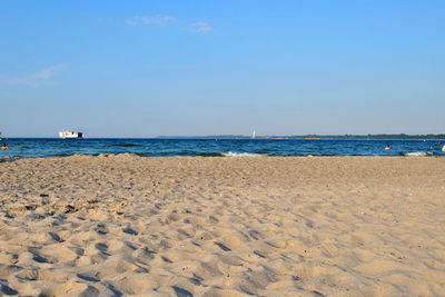 Scenic view of beach against clear sky