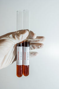 Close-up of glass bottle against white background