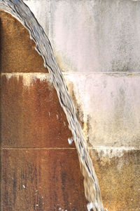Close-up of water fountain against wall