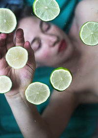 Full frame shot of woman with lime