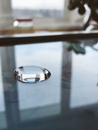 High angle view of glass - material window on table