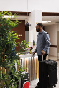 Side view of man working at home