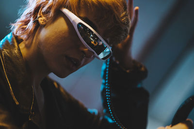 Young woman wearing smart glasses