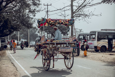 Rear view of people on road