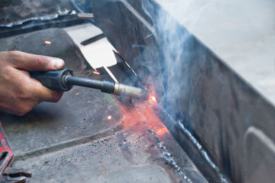 Man working on metal