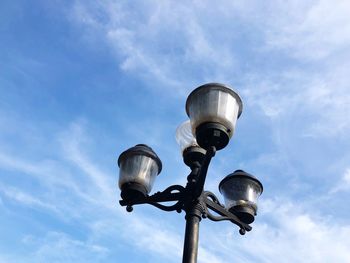 Low angle view of street light against sky