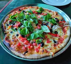 High angle view of pizza in plate on table