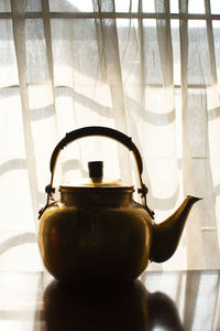 Close-up of teapot on table