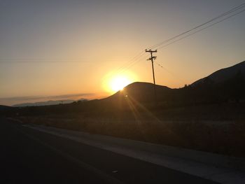 Empty road at sunset