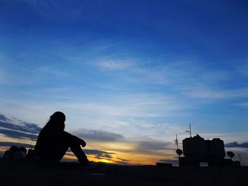 Woman looking at sunset