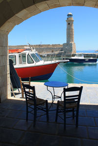 Chairs and tables against blue sky