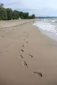 High angle view of footprints on beach