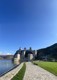 Scenic view of sea against clear blue sky