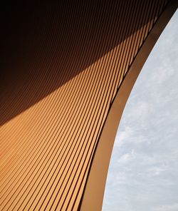 Low angle view of building against cloudy sky