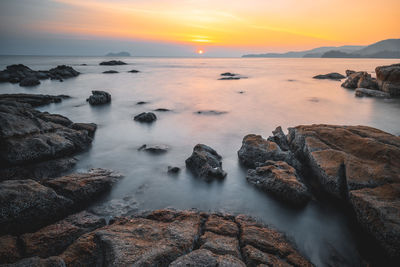 Scenic view of sea against sky during sunset