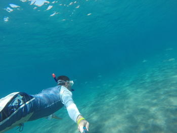 Portrait of man swimming undersea