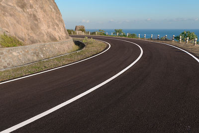 Empty road against sky