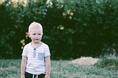 Boy standing on field