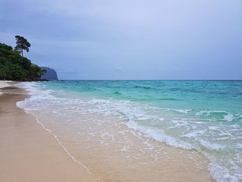 Scenic view of beach against sky