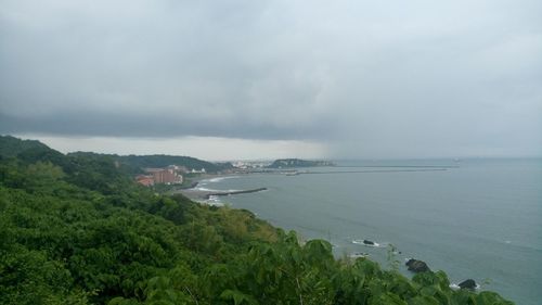 High angle view of sea against cloudy sky