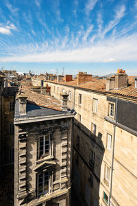 Buildings in city against sky