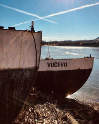 Boats moored in sea against sky