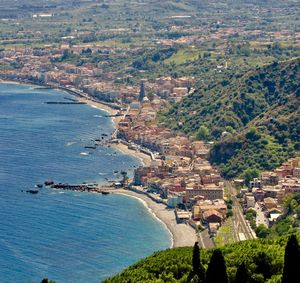 High angle view of city by sea