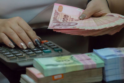Close-up of hand holding paper
