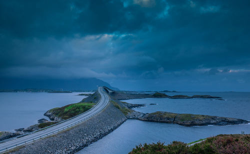 Panoramic view of road by sea against sky