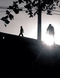 Low angle view of silhouette people