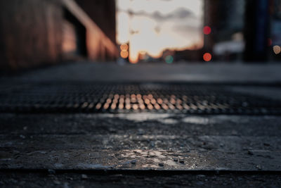 Surface level of railroad tracks at sunset