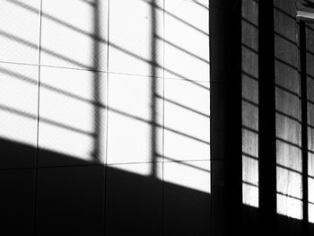 Close-up of shadow on tiled floor