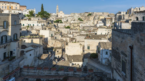 Buildings in town against sky