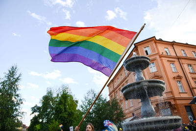 Low angle view of flags against sky