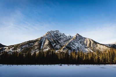 Scenic view of snowcapped mountains against sky during winter