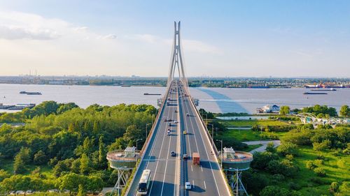 High angle view of bridge and cityscape against sky