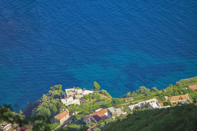 High angle view of buildings by sea