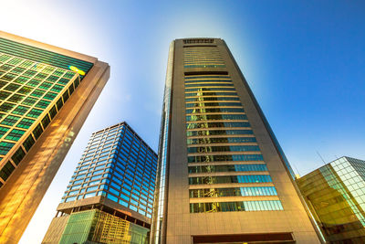 Low angle view of modern buildings against clear sky