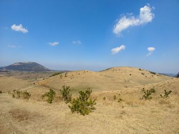 Scenic view of arid landscape against sky