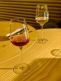 Close-up of wine glasses on table