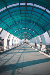 People walking on bridge in city