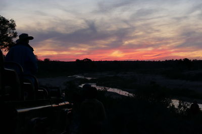 Scenic view of landscape against sky at sunset