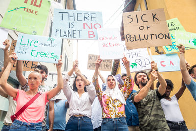 People protesting while standing on land