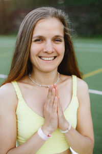 Portrait of smiling young woman looking away