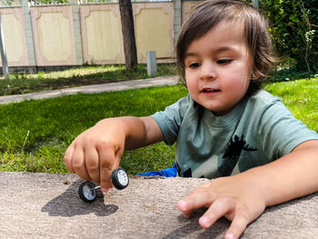 Portrait of cute boy playing in park