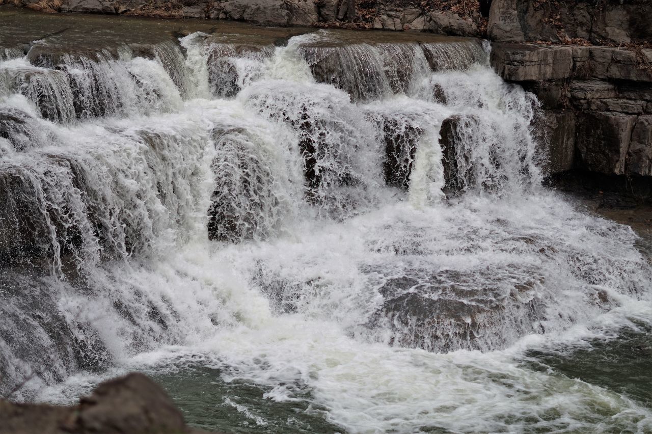 WATER FLOWING THROUGH ROCKS