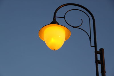 Low angle view of street light against clear sky at night