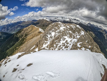 Scenic view of snowcapped mountains against sky