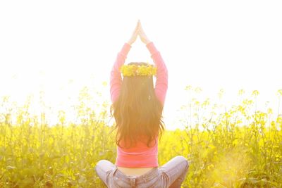 Woman practicing yoga outdoors