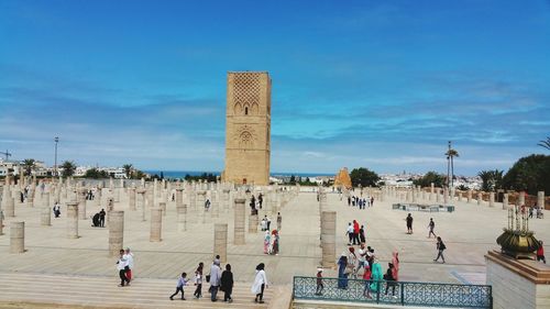 Group of people in front of historical building